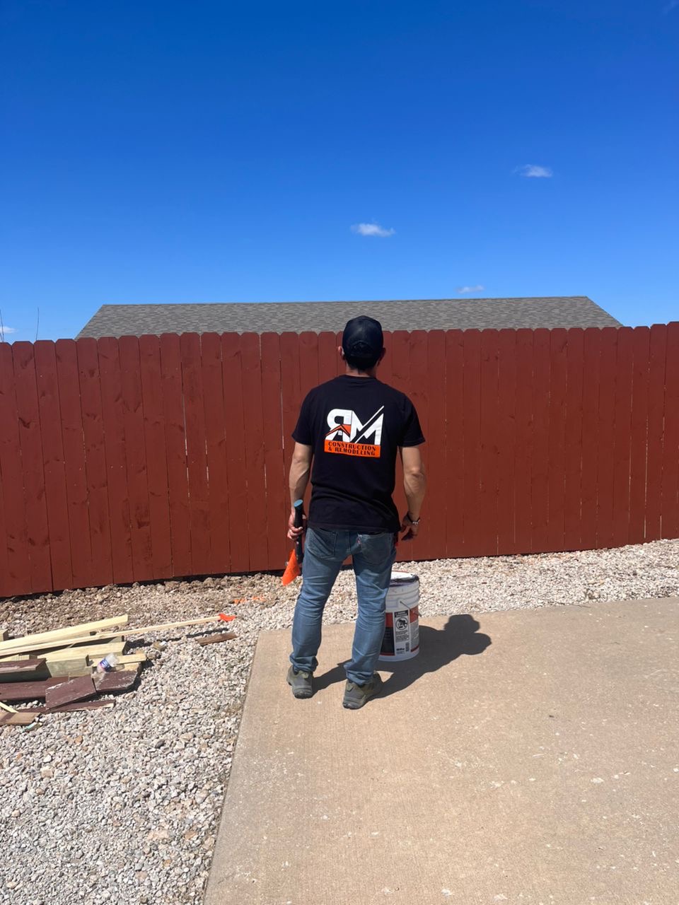 RM Construction team member at a fence project